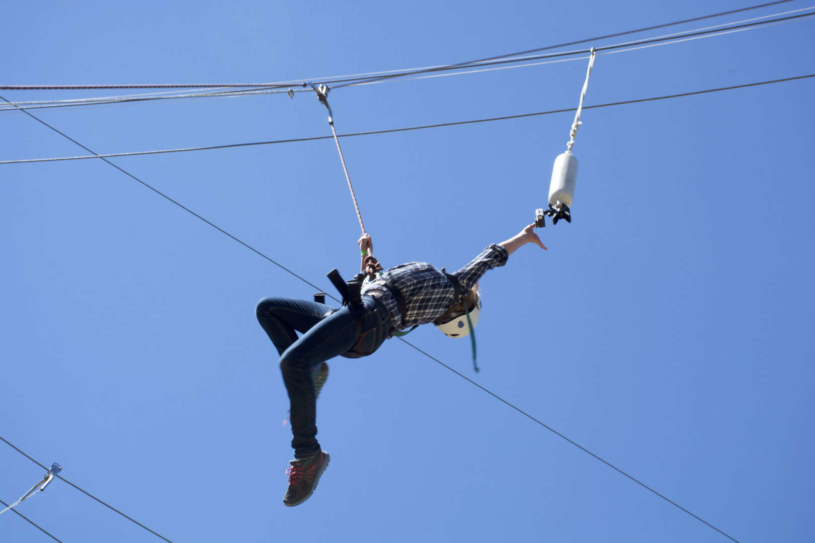 Ziplining at Camp Arnes, outdoor adventure activity in Manitoba with scenic views, suitable for families and thrill-seekers, offering memorable experiences in nature.
